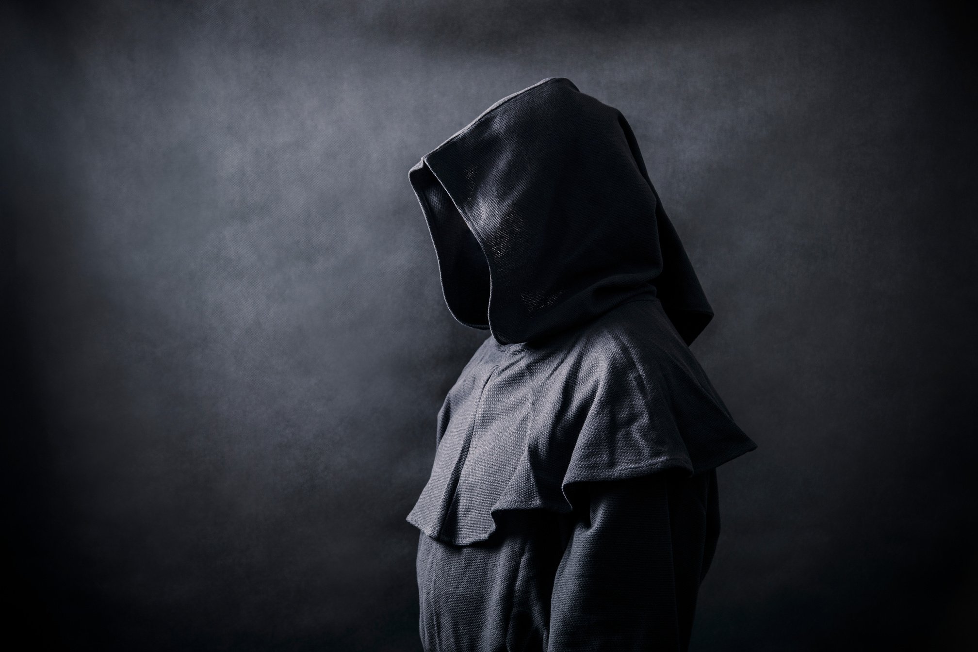 Scary figure in hooded cloak